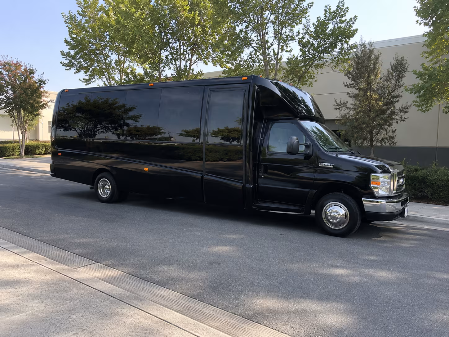 Friends laughing during a party bus celebration in Chula Vista